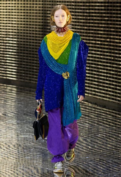 Review: At Gucci, it’s fashion as mask work and spiked collars for 